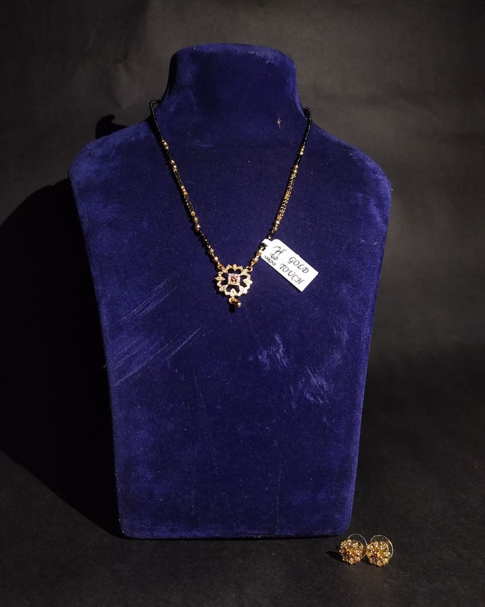 Mor Phool Mangalsutra Set, Black-bead chain with a round floral pendant, ruby centre, matching studs