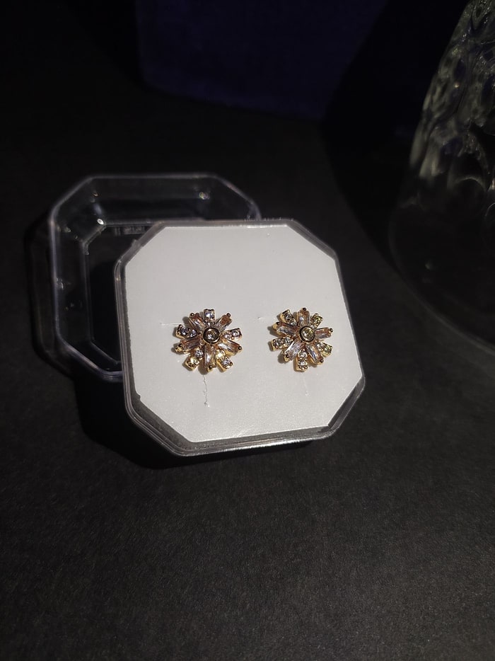 Suraj Studs, Starburst stud, champagne CZ rays with a pink centre stone