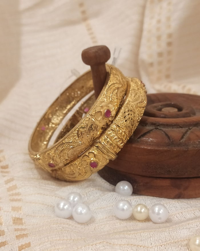 Kemp Nakshi Kada, Floral nakshi-carved openable hinge-clasp bangle pair, ruby accents