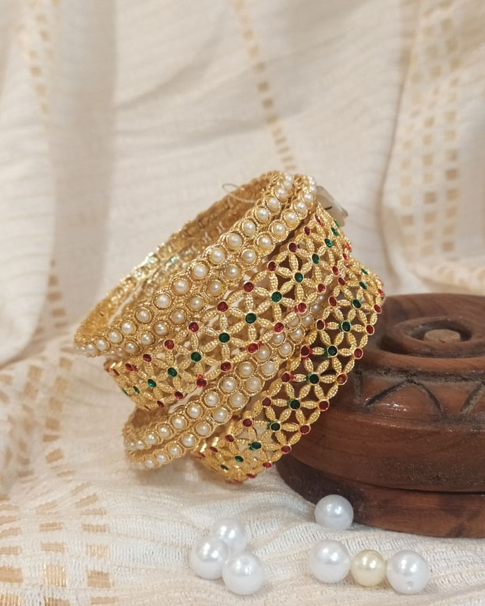 Kemp Nakshi Bangadi, Floral cutwork bangle pair, leaf filigree with pearl and ruby-green accents